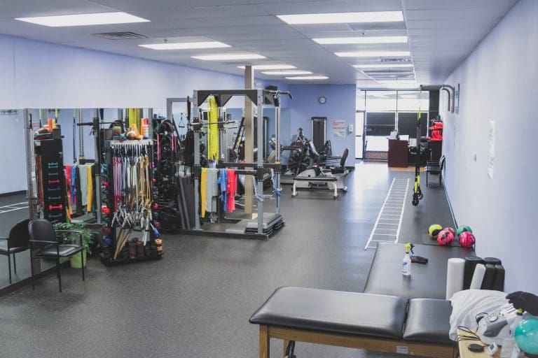 Wide view of the gym floor and treatment table at BeneFIT Physical Therapy's Chester, NJ clinic